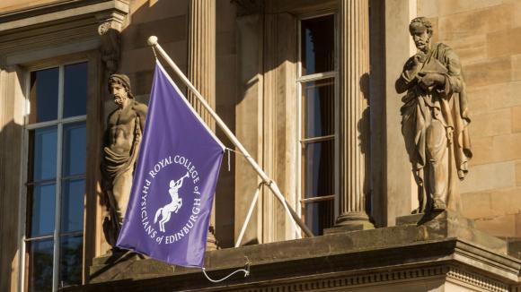 college purple flag on building