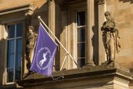 college purple flag on building