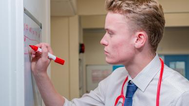 Doctor writing on whiteboard