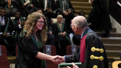 woman presented with diploma