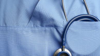 chest of person in scrubs