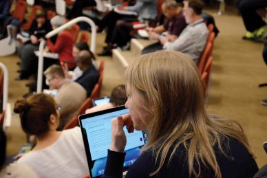 woman on laptop at event
