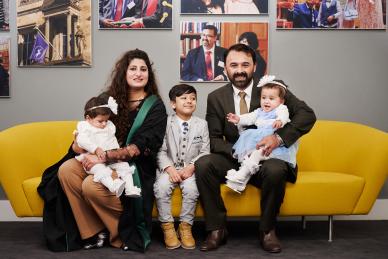 family on yellow couch