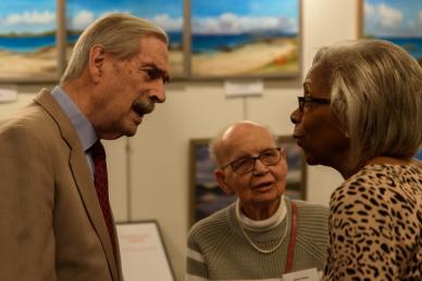 three people in conversation