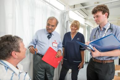 Doctors talking to a patient