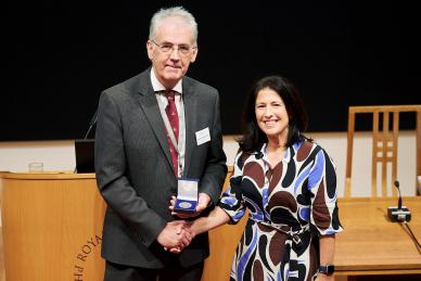 women and man shaking hands