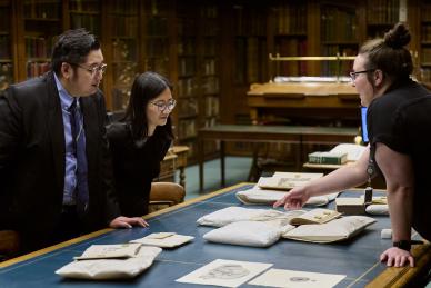 woman displays artefacts