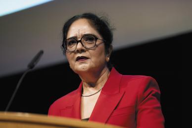 woman speaking at podium