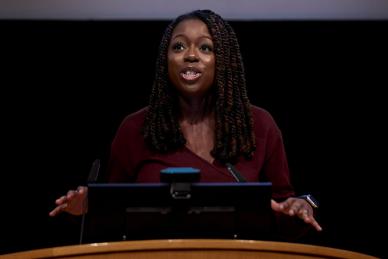 women speaks at podium