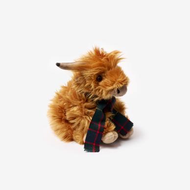Photo of highland cow soft toy wearing College tartan scarf.