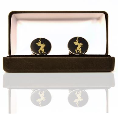 Photo of Embossed black cufflinks with engraved gold Chiron, presented in a cufflink box.