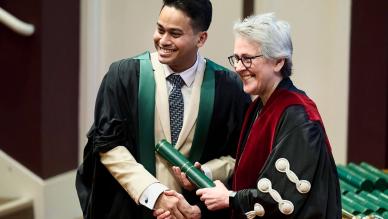 receiving diploma