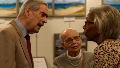 three people in conversation