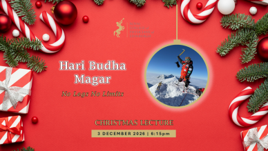 A photograph of Hari Budha Magar, on the top of a snowy peak, is inside a Christmas bauble. The bauble hangs on a red background with other baubles, Christmas presents and Christmas tree branches making a border. 